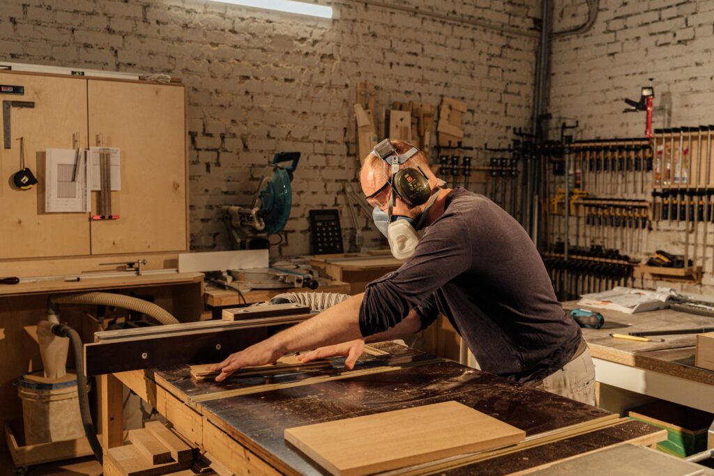 A Provider Man in Brown Long Sleeve Shirt Doing Woodworks